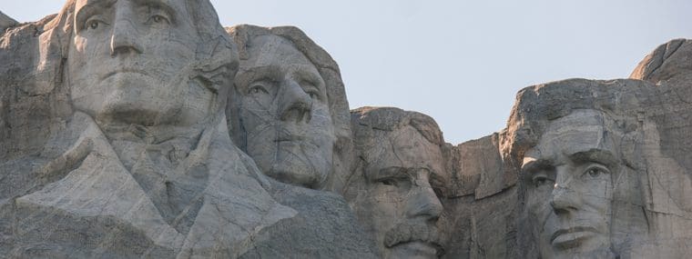 A close up of the faces on mount rushmore